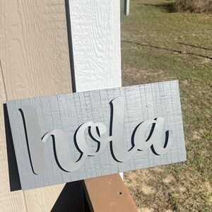 Gray Wooden 'Hola' Sign